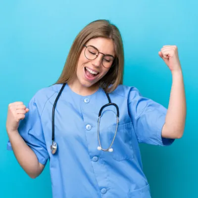 happy-nurse-celebrating-success-in-uniform