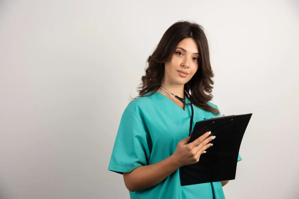 nurse-holding-tablet-standing-radha-patel-np-reviews