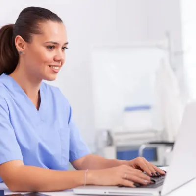 nurse-working-on-laptop-in-clinic